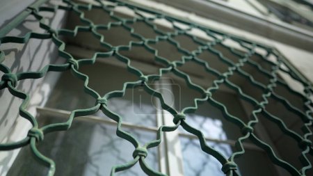 Photo for Window metal cage with patterns protecting building from intruders. Fence protection - Royalty Free Image