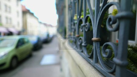 Photo for European street sidewalk with elegant protective window gate in foreground - Royalty Free Image