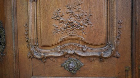 Photo for Ornamentation detail on traditional ancient wooden door. Flower adornment intricacy, handcraft material - Royalty Free Image