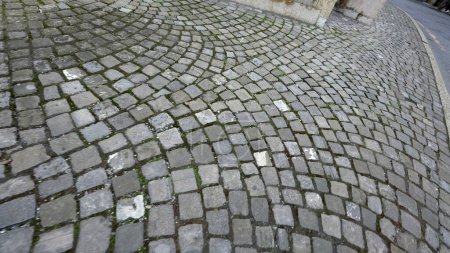 Photo for Ancient old cobblestone walkway POV of person walking in European sidewalk - Royalty Free Image