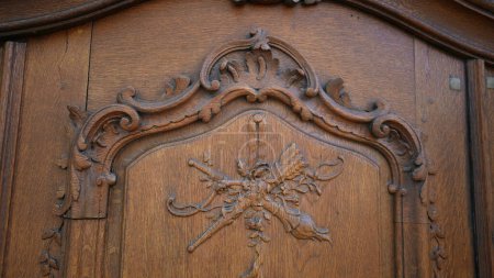 Photo for Traditional Door Artistry - Detailed Flower Adornment on Aged Wood. Handcrafted Floral Intricacy. Ancient Wooden Door Ornamentation - Royalty Free Image