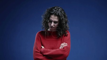 Photo for Fearful woman crossing arms feeling afraid and scared. Negative protective boduy language, feeling depressed and apprehensive - Royalty Free Image