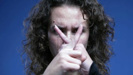 Photo for Upset Woman Pointing Finger at Camera, Waving 'NO' in Rejection, Close-up of Negative Body Language making an "X" with hands - Royalty Free Image