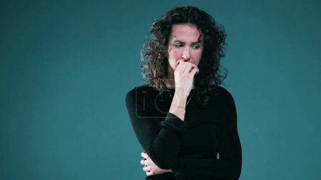 Photo for Nervous Person Biting Nails and fidgeting Amid Mental Pressure, woman struggles with anxiety - Royalty Free Image