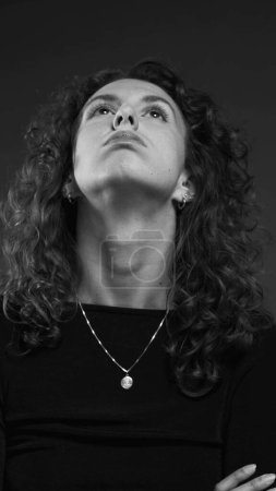 Photo for Tired woman experiencing bored, sighing and feeling fatigue, exasperated person close-up face in black and white - Royalty Free Image