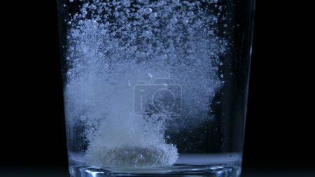 Photo for Carbonated Water with Vitamin C Tablet - Sport Medication and Wellness on black backdrop - Royalty Free Image