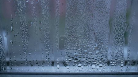 Photo for Droplets on glass window during winter cold season, condensation effect - Royalty Free Image
