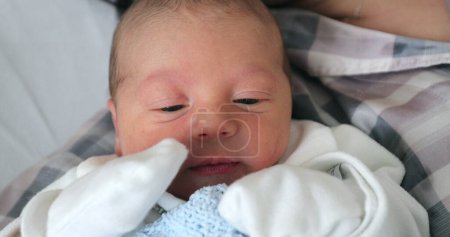Photo for Baby newborn with mom layed in hospital bed - Royalty Free Image