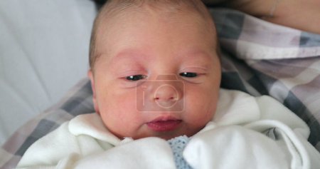 Photo for Baby newborn with mom layed in hospital bed - Royalty Free Image
