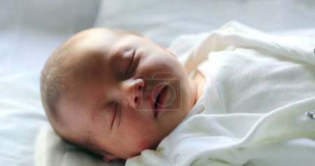 Téléchargez les photos : Newborn baby boy asleep in first day of life - en image libre de droit