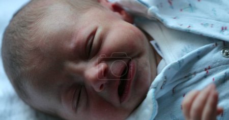 Foto de Upset newborn baby crying wanting attention - Imagen libre de derechos