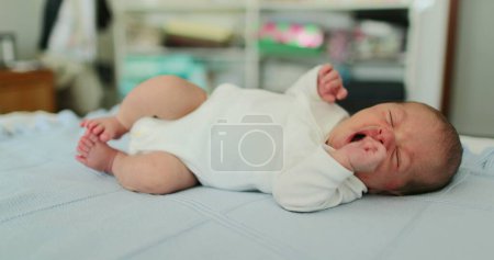 Photo for Infant newborn baby sleeping resting in bed - Royalty Free Image