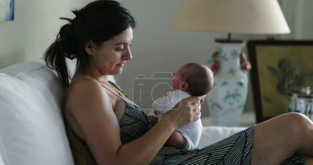 Photo for Mother holding newborn baby in her arms first week of life - Royalty Free Image