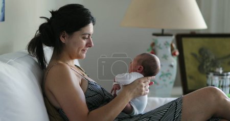 Photo for Mother holding newborn baby in her arms first week of life - Royalty Free Image