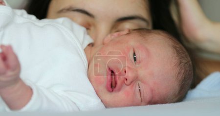 Photo for Newborn baby infant sleeping in bed - Royalty Free Image