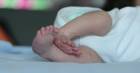 Photo for Newborn feet, close-up of baby tiny feet during first week of life - Royalty Free Image