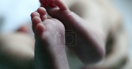 Foto de Small newborn baby feet in first days of life - Imagen libre de derechos