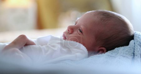 Photo for Portrait of a beautiful sleeping baby waking up from nap - Royalty Free Image