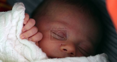 Photo for Close-up of newborn baby infant inside crib sleeping - Royalty Free Image