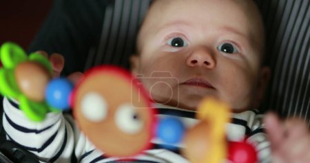 Foto de Baby toddler infnant inside rocker baby chair - Imagen libre de derechos