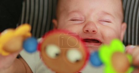 Foto de Toy spinning with baby infant in background - Imagen libre de derechos