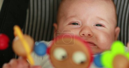 Foto de Toy spinning with baby infant in background - Imagen libre de derechos