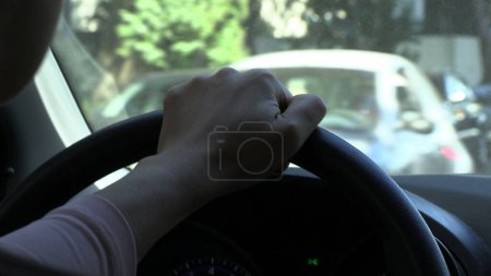 Photo for Person hands holding steering wheel driving - Royalty Free Image