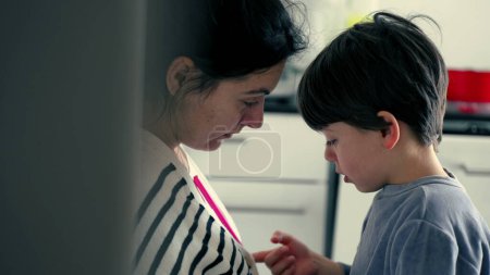 Photo for Small Boy Tearfully Listens to Mother's Scolding for Misbehavior, Learning Lesson - Royalty Free Image