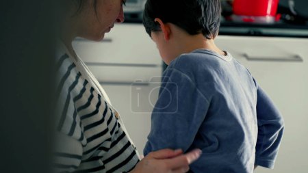 Photo for Tearful Child Learns Lesson from Mother's Scolding, Nods in Understanding - Royalty Free Image