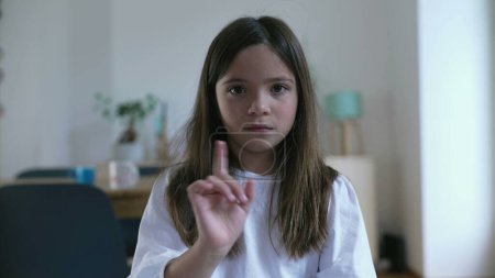 Little Girl Pointing at Herself in surprise and Disbelief, Then Shaking Finger in Rejection saying NOT ME