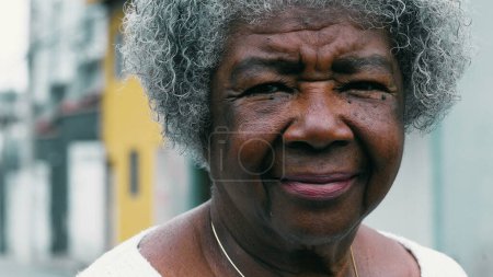 Photo for Thoughtful Gaze of Elderly African American Woman in Her 80s, Portrait of Wisdom in old age. One older Brazilian lady looking at camera - Royalty Free Image
