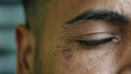 Photo for Detail macro close-up of a hispanic black man closing eye in meditation. serene peaceful contemplation person practicing mindfulness - Royalty Free Image
