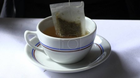 Photo for Putting sack tea bag closeup - Royalty Free Image