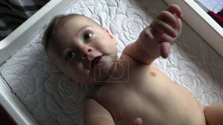 Photo for Cute happy baby 5 month old baby looking to camera smiling - Royalty Free Image