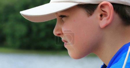 Photo for Profile of thoughtful young boy looking at distance thinking about life - Royalty Free Image