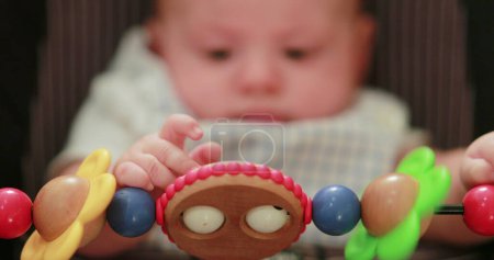 Photo for Newborn baby playing chair toy - Royalty Free Image