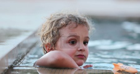 Photo for Portrait of handsome baby boy inside swimming pool water - Royalty Free Image