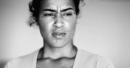 Photo for Overwhelmed young African American woman pressing head side temples feeling mental pressure and anxiety, close-up face of person feel stress and indignation - Royalty Free Image