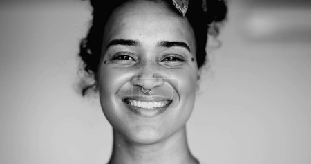 Photo for Happy Black Latina of African Descent Smiling at Camera with Friendly Expression in black and white  Monochromatic Portrait of Brazilian Young Woman in Her 20s - Royalty Free Image