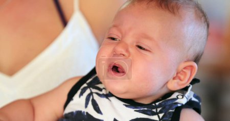 Photo for Baby with displeased face expression reaction - Royalty Free Image