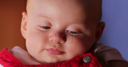 Foto de Baby face expression closeup handsome infant portrait - Imagen libre de derechos