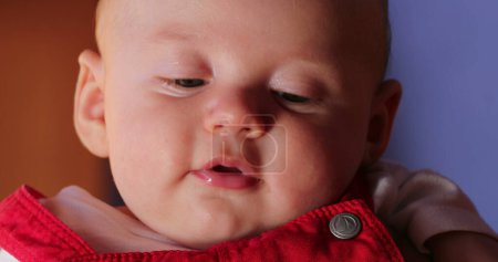 Foto de Baby face expression closeup handsome infant portrait - Imagen libre de derechos