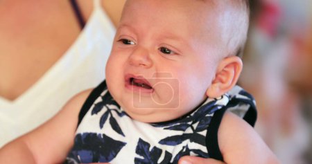Photo for Baby with displeased face expression reaction - Royalty Free Image
