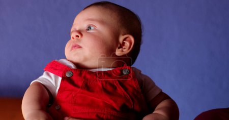 Photo for Curious Infant baby looking around observing world - Royalty Free Image