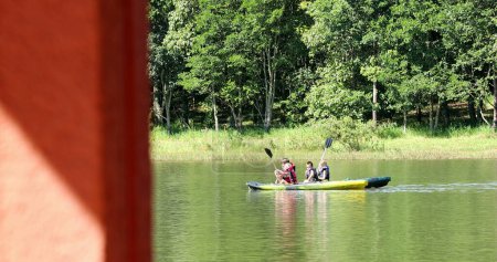 Photo for Kids kayaking outside at lake inside canoe - Royalty Free Image