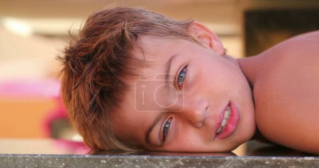Téléchargez les photos : Handsome child young small boy looking to camera outdoors - en image libre de droit