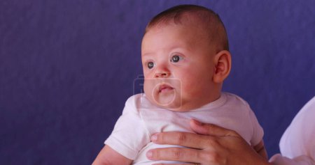 Photo for Baby infant face looking and observing first months of life - Royalty Free Image