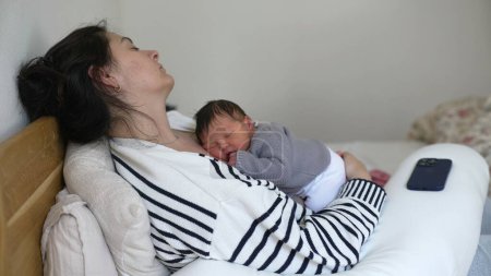Tired Mother and Newborn Asleep Together During Afternoon Nap - Struggling with Fatigue in the First Week of Maternal Care