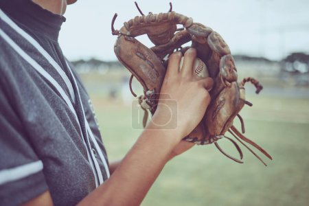 Photo for Baseball player, hands or ball in mitt on grass field for fitness, workout and training in game, match and competition. Zoom, baseball glove and sports athlete in energy exercise for softball pitcher. - Royalty Free Image