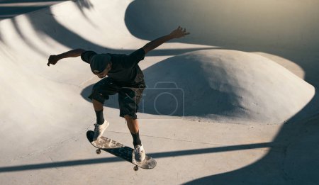 Man, skater and skateboard at park in air, trick or jump on ramp with speed, technique and sport. Skateboarder, action and concrete at event, game or contest with shoes in summer, sunshine or outdoor.